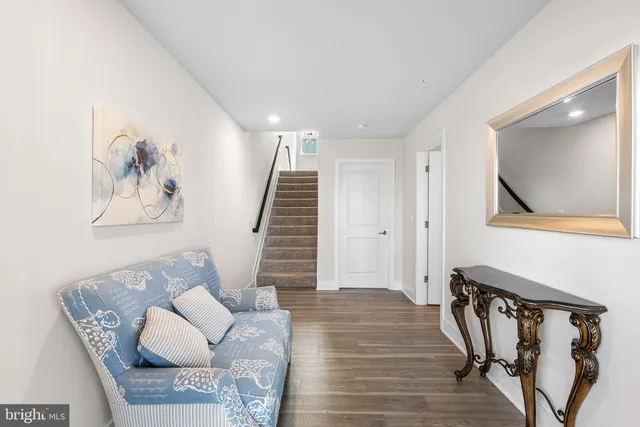 a bedroom with a bed a table and chair