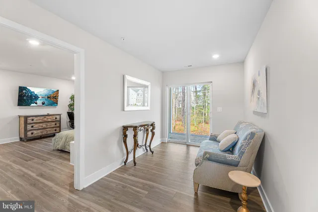a bathroom with a granite countertop sink mirror vanity and toilet