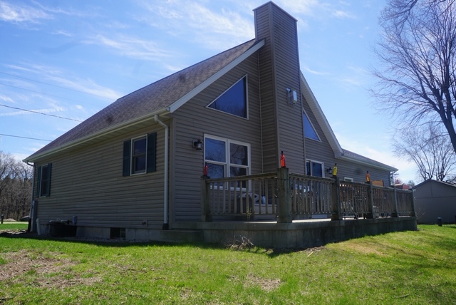 7054 South Rock Nation Road Dixon, IL 61021 - Photo 14 of 17 a view of a house with a yard