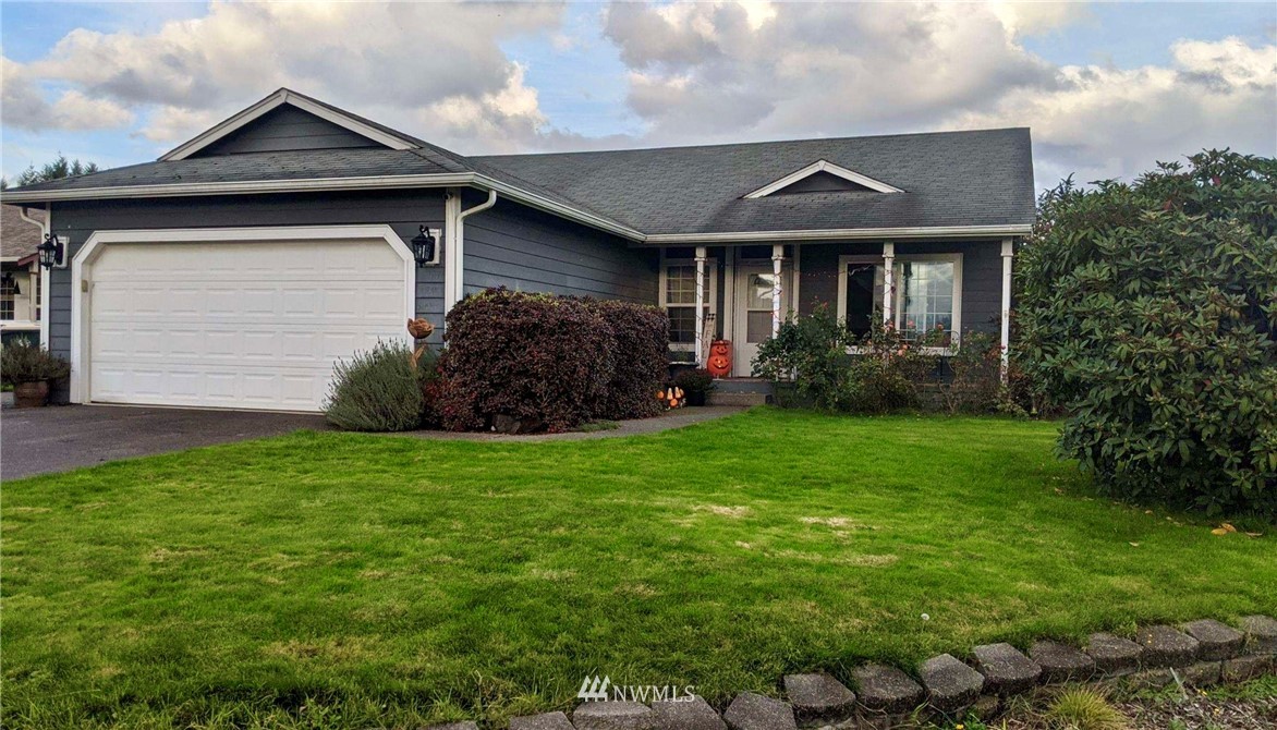 8016 188th Avenue Southwest Rochester, WA 98579 - Photo 1 of 16 a front view of a house with a garden
