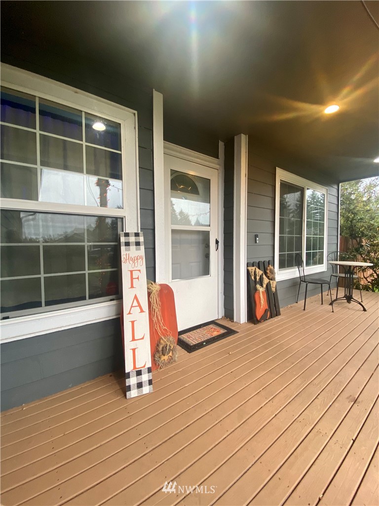 8016 188th Avenue Southwest Rochester, WA 98579 - Photo 2 of 16 a view of a hall with wooden floor and floor to ceiling window