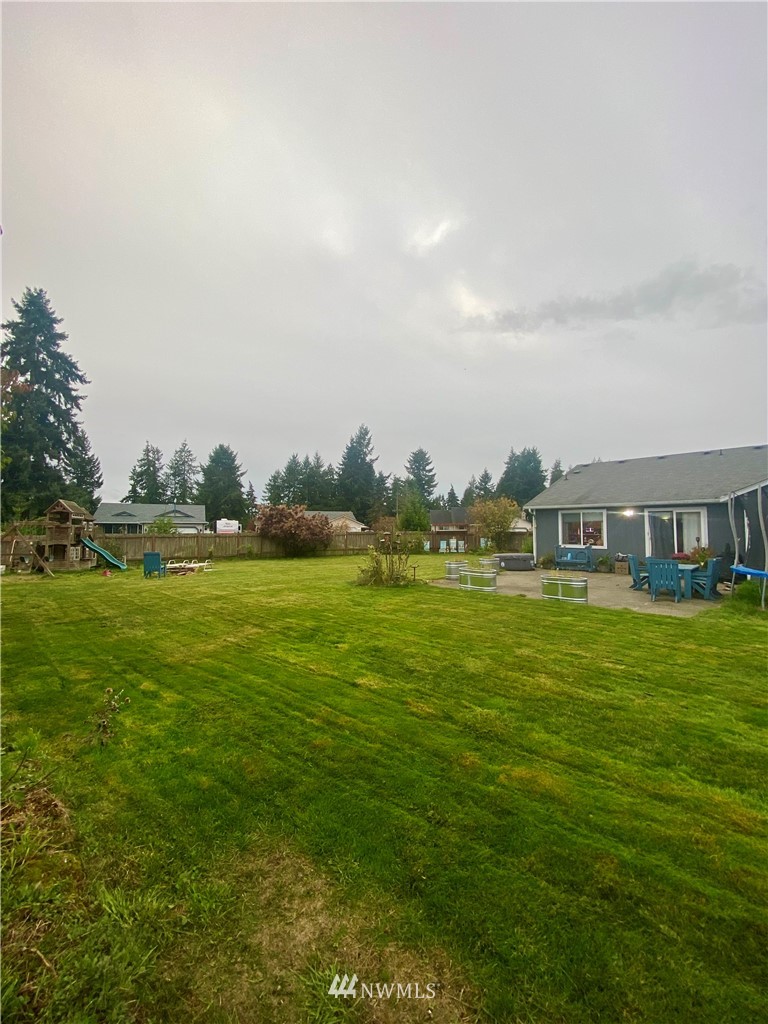 8016 188th Avenue Southwest Rochester, WA 98579 - Photo 15 of 16 a front view of a house with a garden