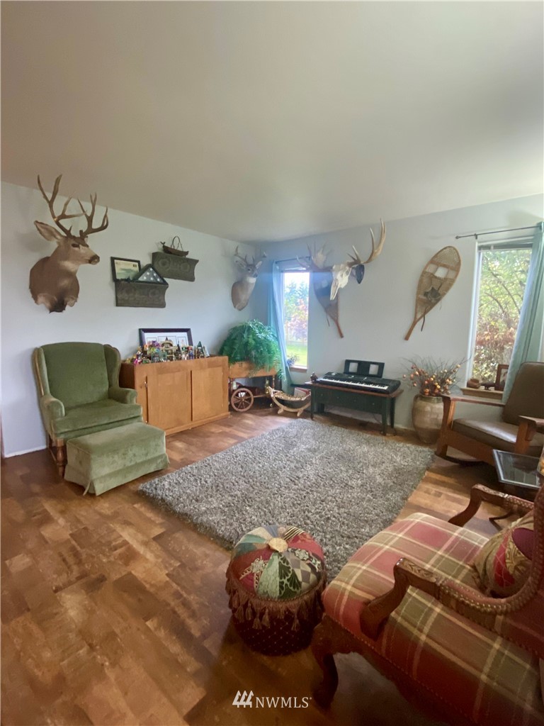 8016 188th Avenue Southwest Rochester, WA 98579 - Photo 3 of 16 a living room with furniture and a lamp