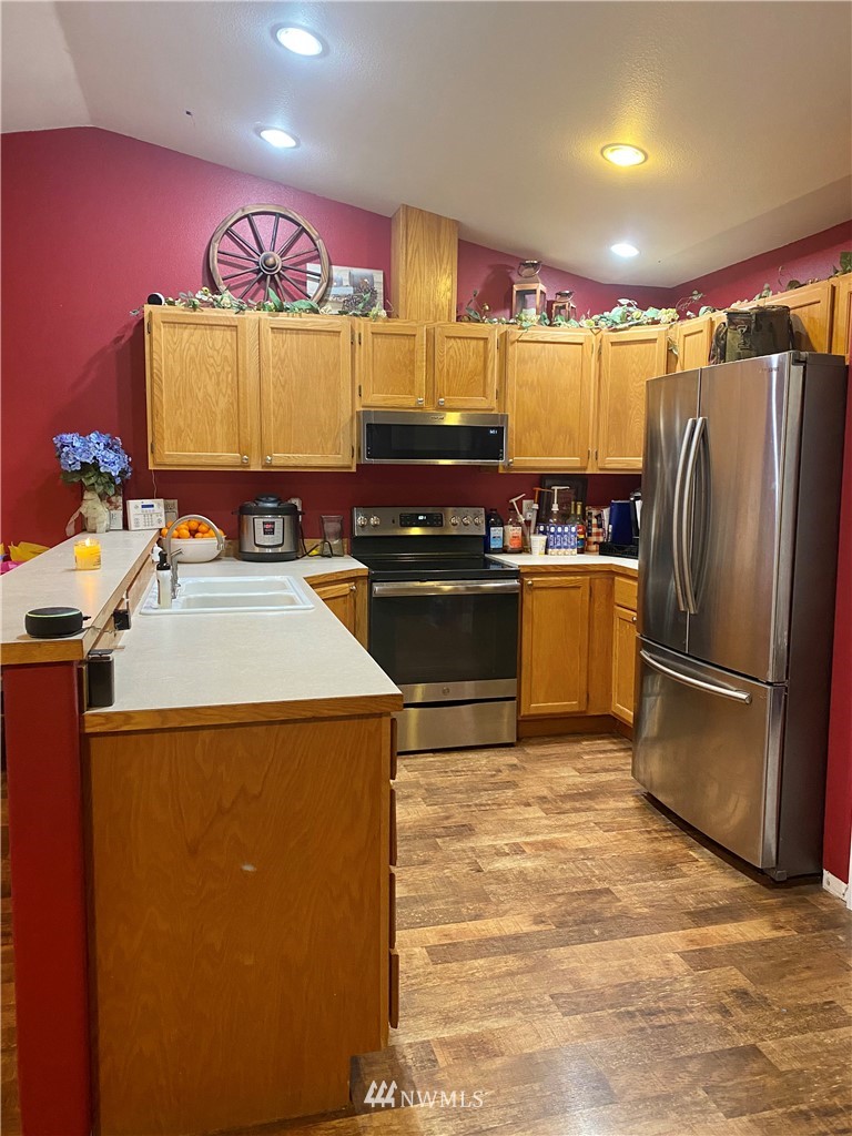 8016 188th Avenue Southwest Rochester, WA 98579 - Photo 4 of 16 a kitchen with refrigerator and cabinets