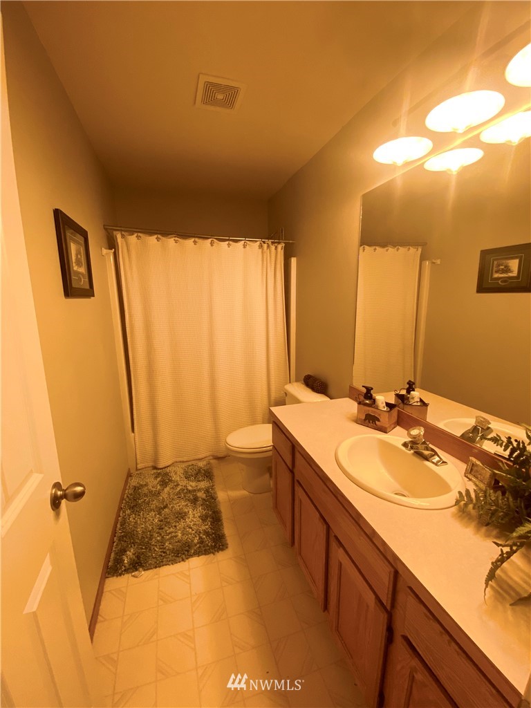 8016 188th Avenue Southwest Rochester, WA 98579 - Photo 8 of 16 a bathroom with a sink and a mirror