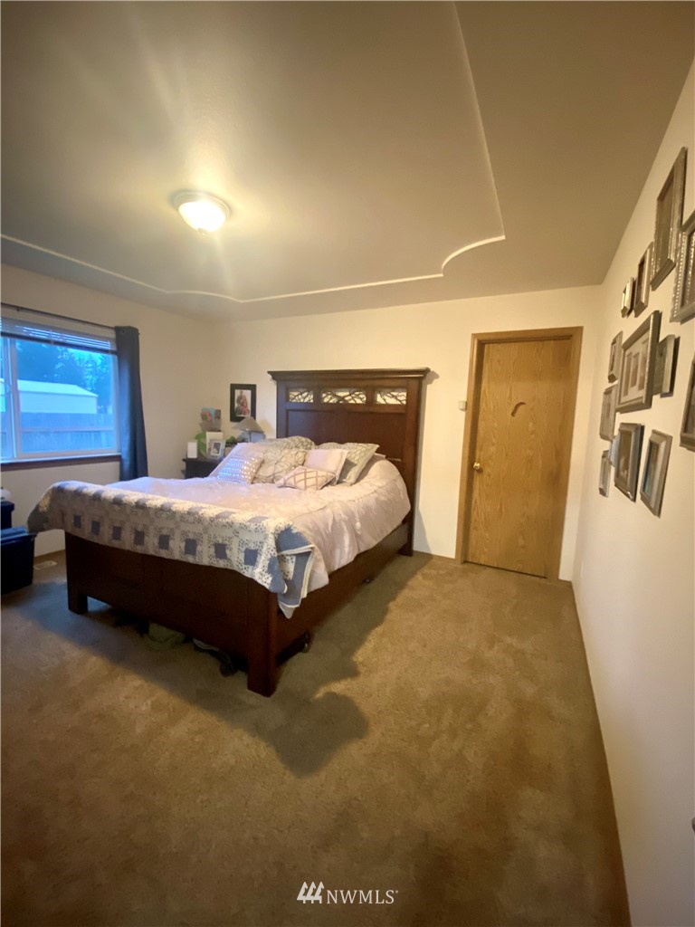 8016 188th Avenue Southwest Rochester, WA 98579 - Photo 10 of 16 a bedroom with a bed and a couch