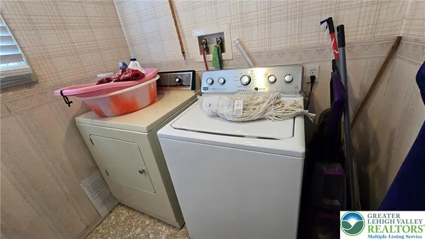 a bedroom with a bed and a mirror