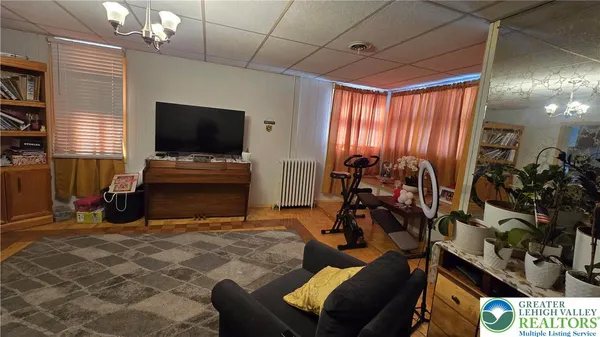 a view of hallway with wooden floor