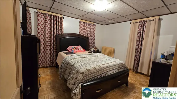 a bedroom with bed and a window
