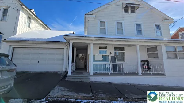 a view of a house with a street