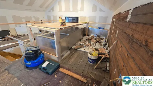 a bedroom with a bed and ceiling fan