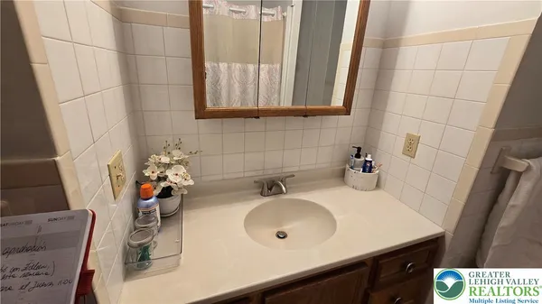 a bedroom with a bed and a mirror