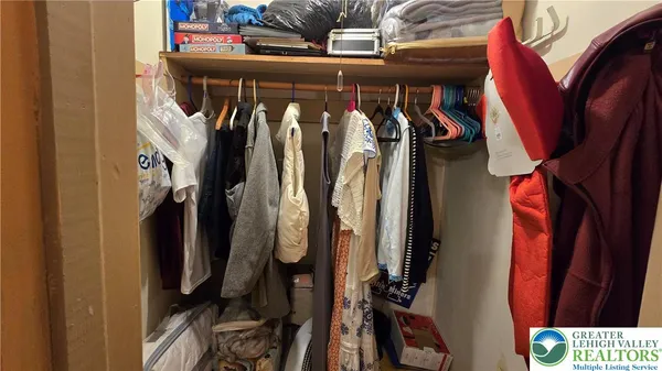 a bedroom with a bed and a closet
