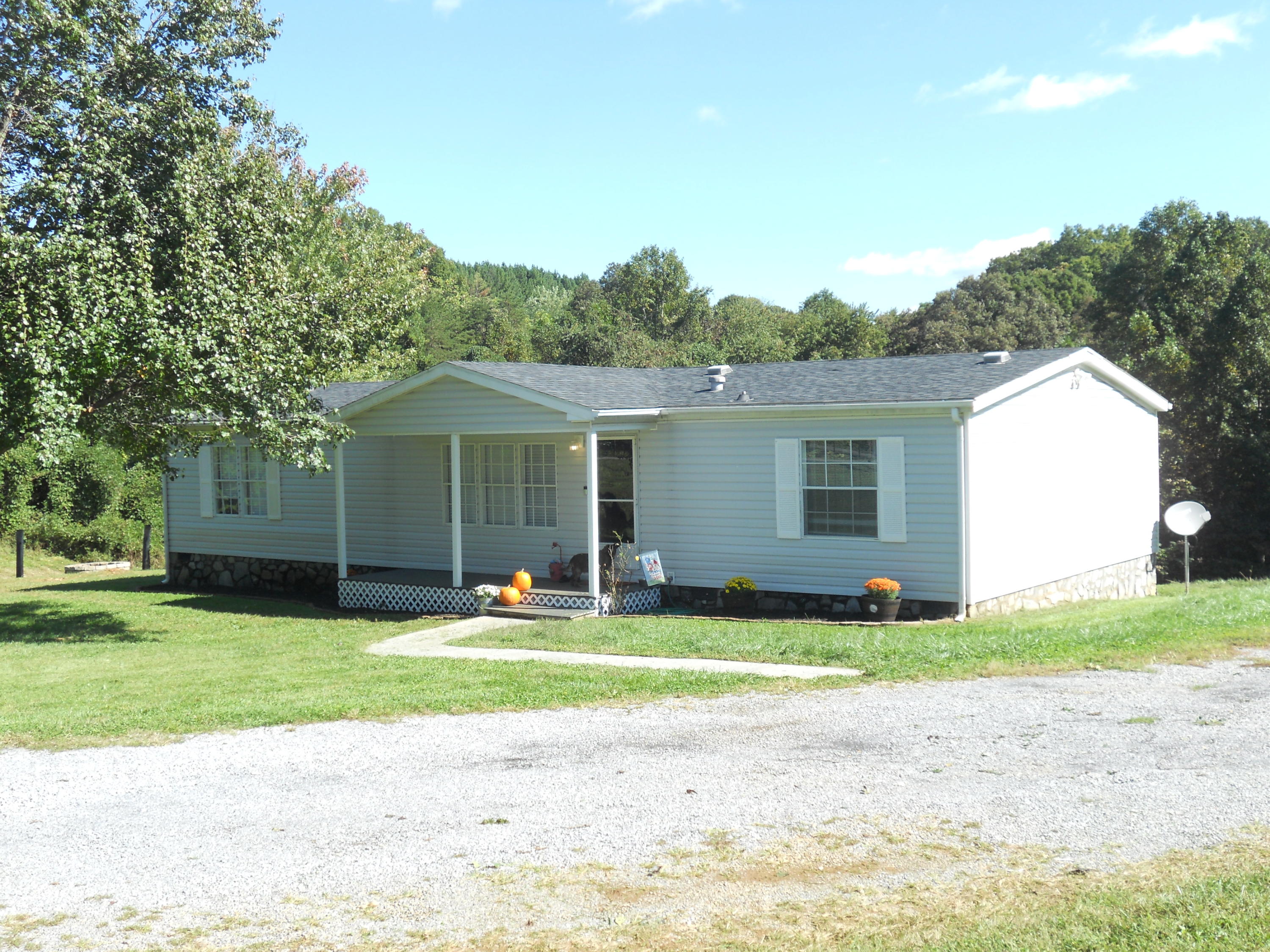 1504 Turner Branch Road Goodview, VA 24095 - Photo 3 of 64 a front view of a house with a yard and garage
