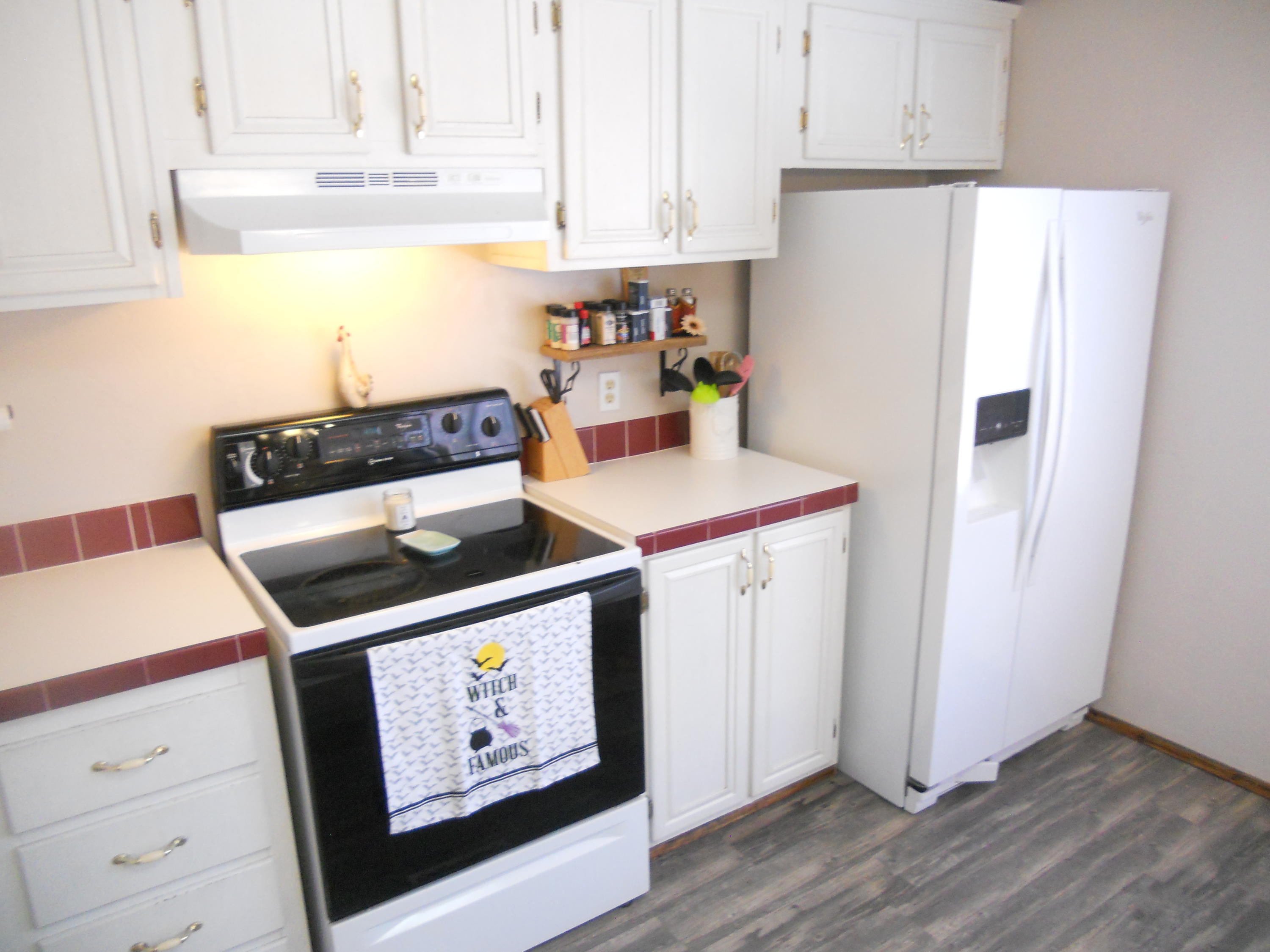 1504 Turner Branch Road Goodview, VA 24095 - Photo 23 of 64 a kitchen with stainless steel appliances a stove a refrigerator and cabinets