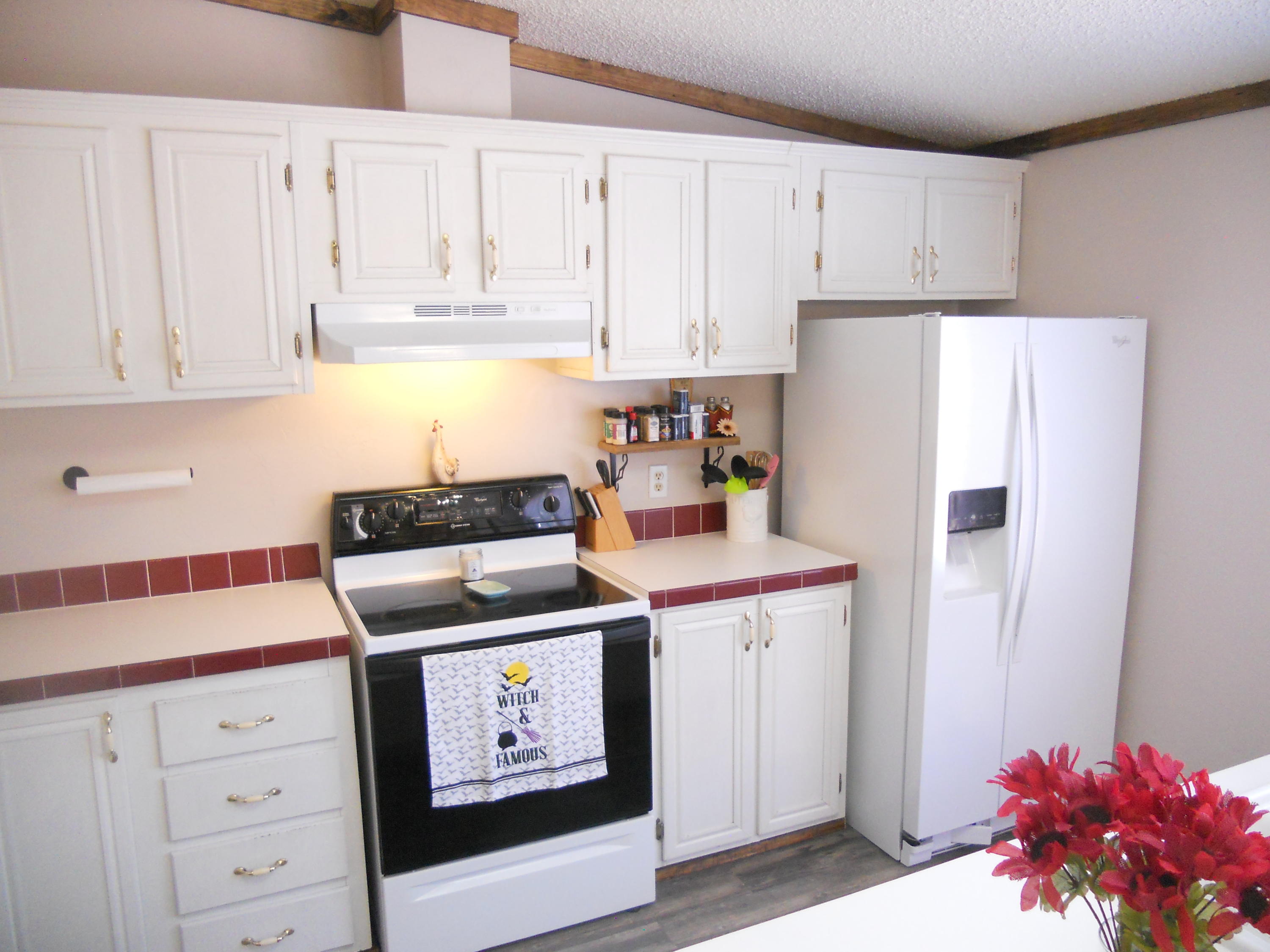 1504 Turner Branch Road Goodview, VA 24095 - Photo 24 of 64 a kitchen with stainless steel appliances white cabinets and a refrigerator