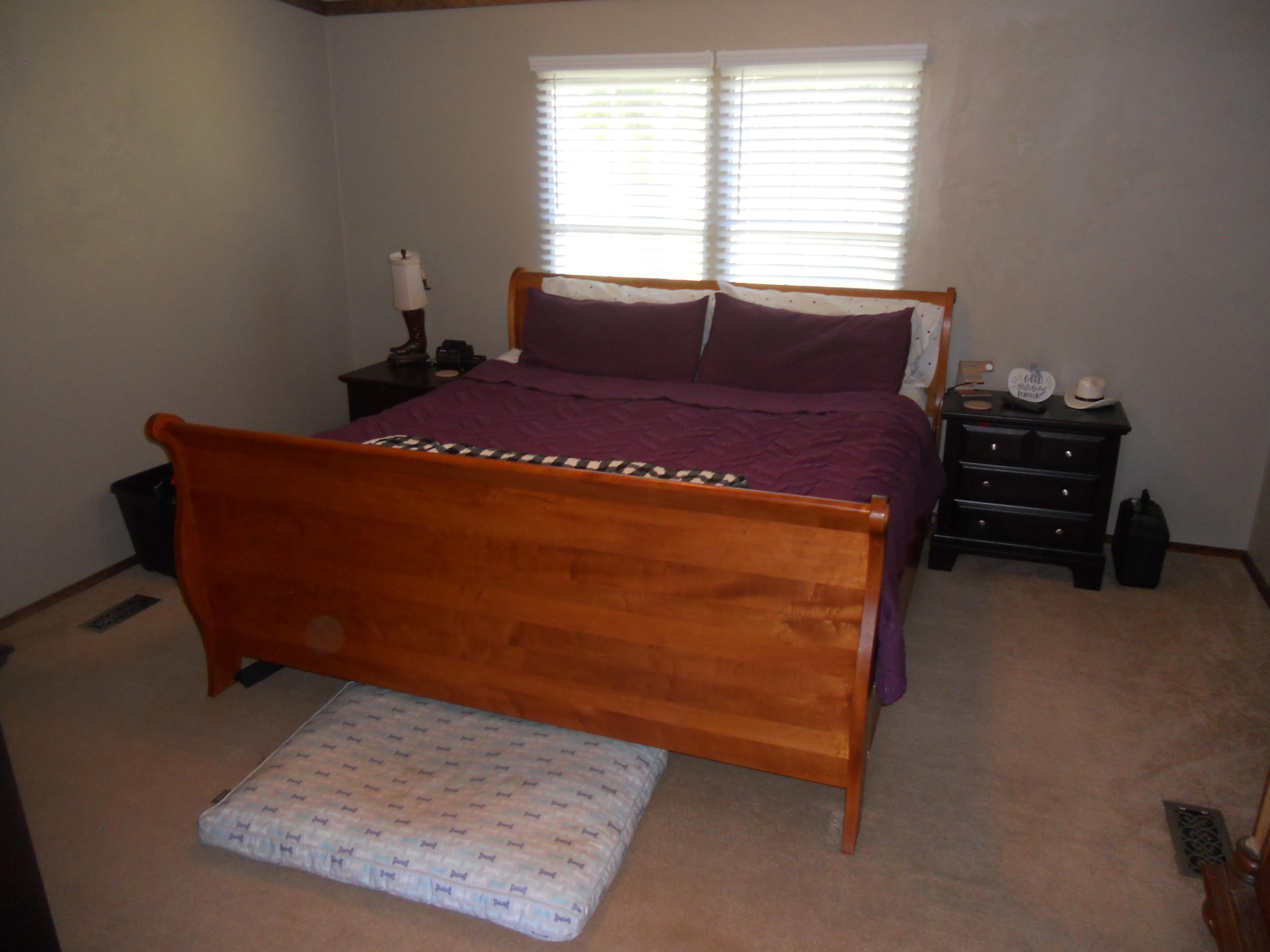 1504 Turner Branch Road Goodview, VA 24095 - Photo 28 of 64 a bed sitting in a bedroom next to a window