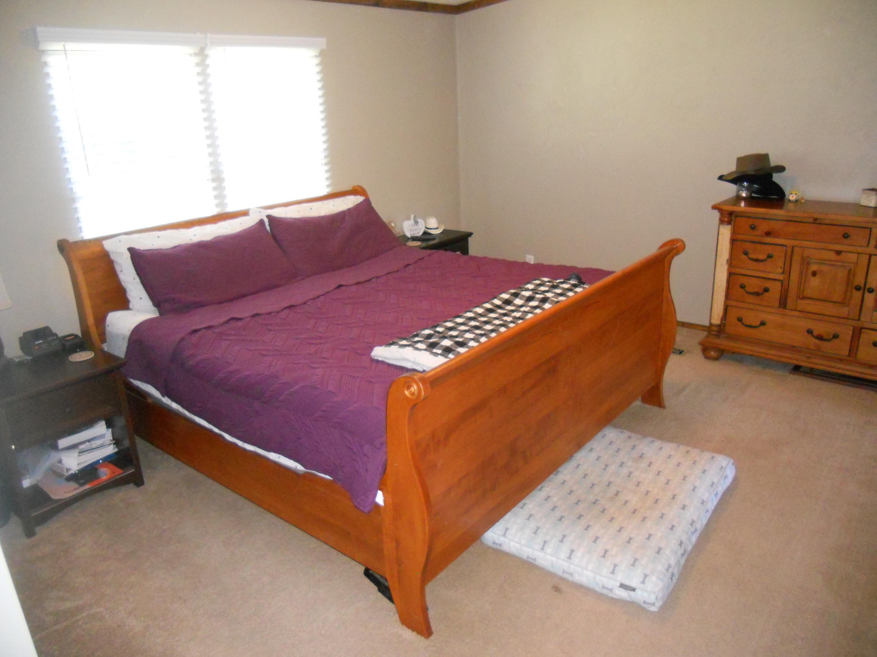 1504 Turner Branch Road Goodview, VA 24095 - Photo 29 of 64 a bed sitting in a bedroom next to a window