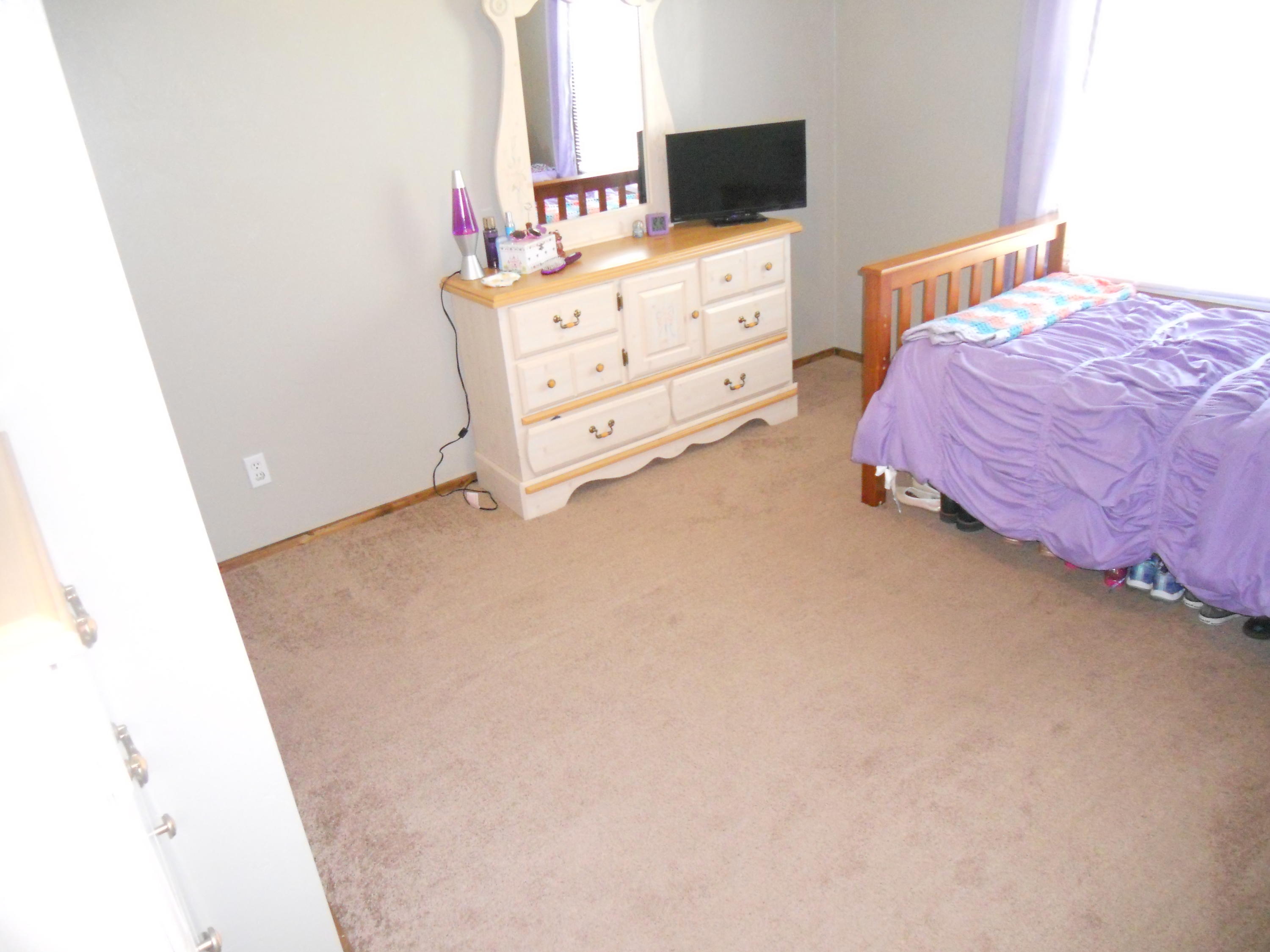 1504 Turner Branch Road Goodview, VA 24095 - Photo 38 of 64 a bedroom with a bed and flat screen tv