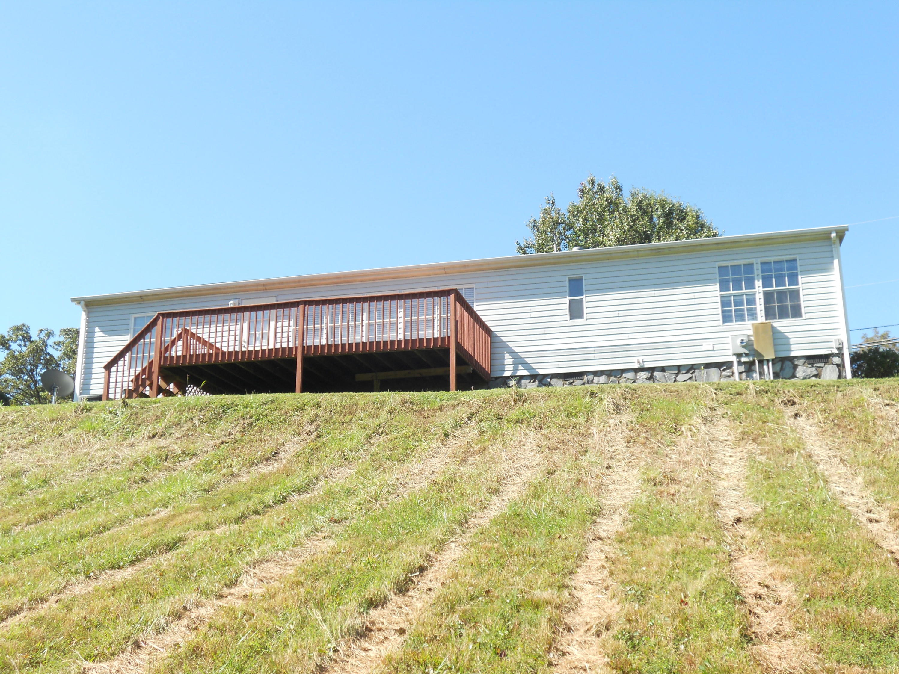 1504 Turner Branch Road Goodview, VA 24095 - Photo 8 of 64 a view of a house with a yard and sitting area