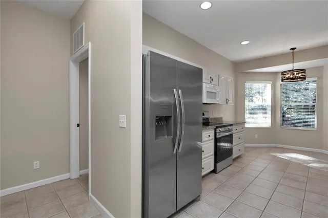 a view of storage and utility room with washer and dryer