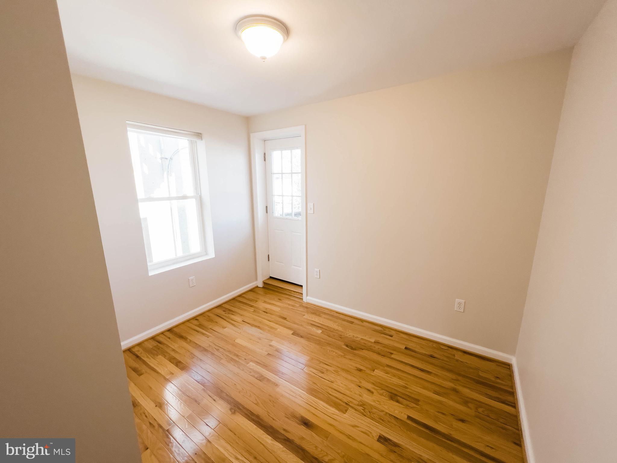 721 South Milton Avenue Baltimore, MD 21224 - Photo 13 of 23 an empty room with window