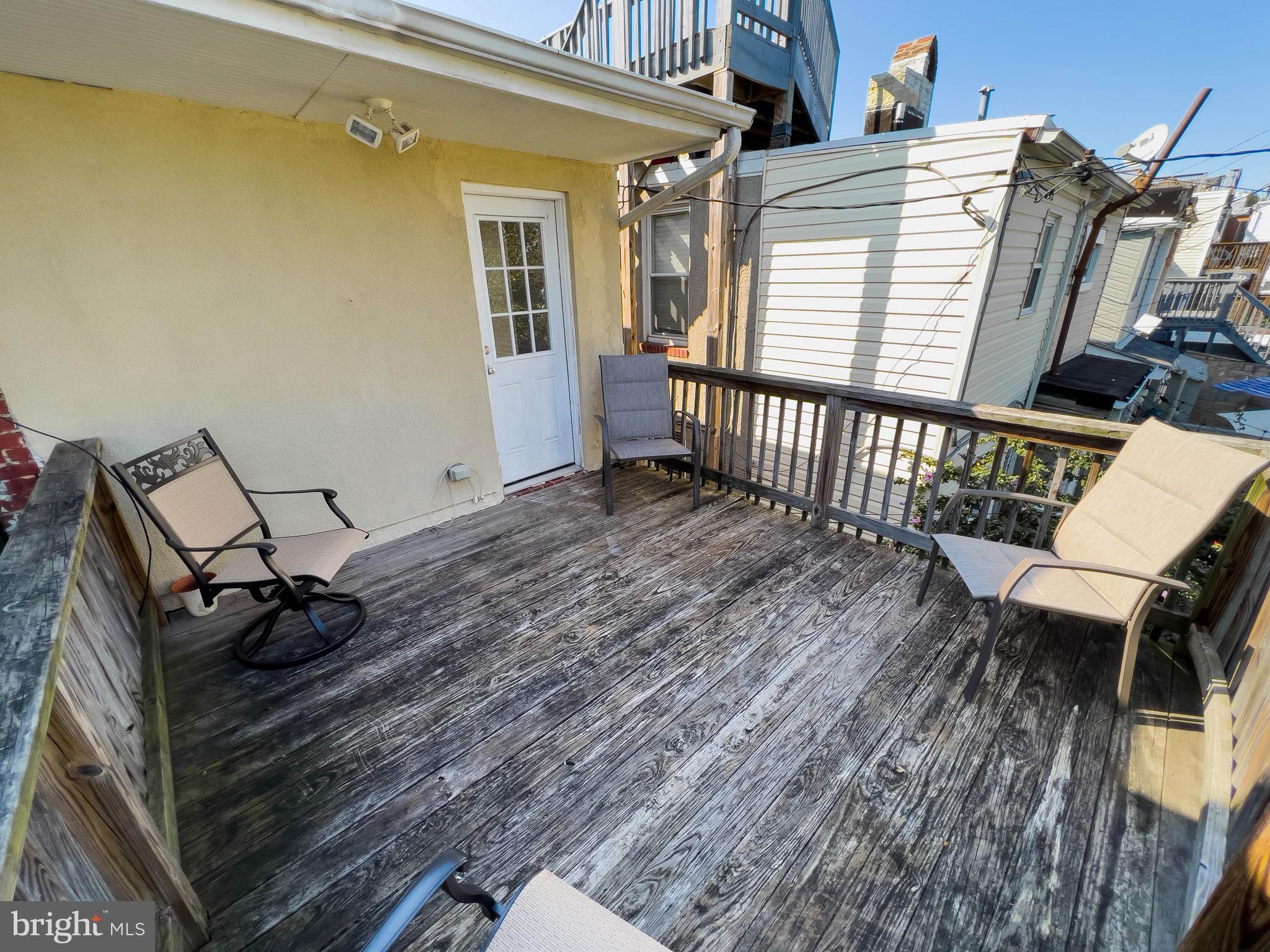 721 South Milton Avenue Baltimore, MD 21224 - Photo 23 of 23 a view of a balcony with chairs