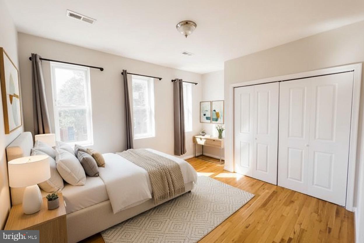 721 South Milton Avenue Baltimore, MD 21224 - Photo 3 of 23 a bedroom with a bed and a window