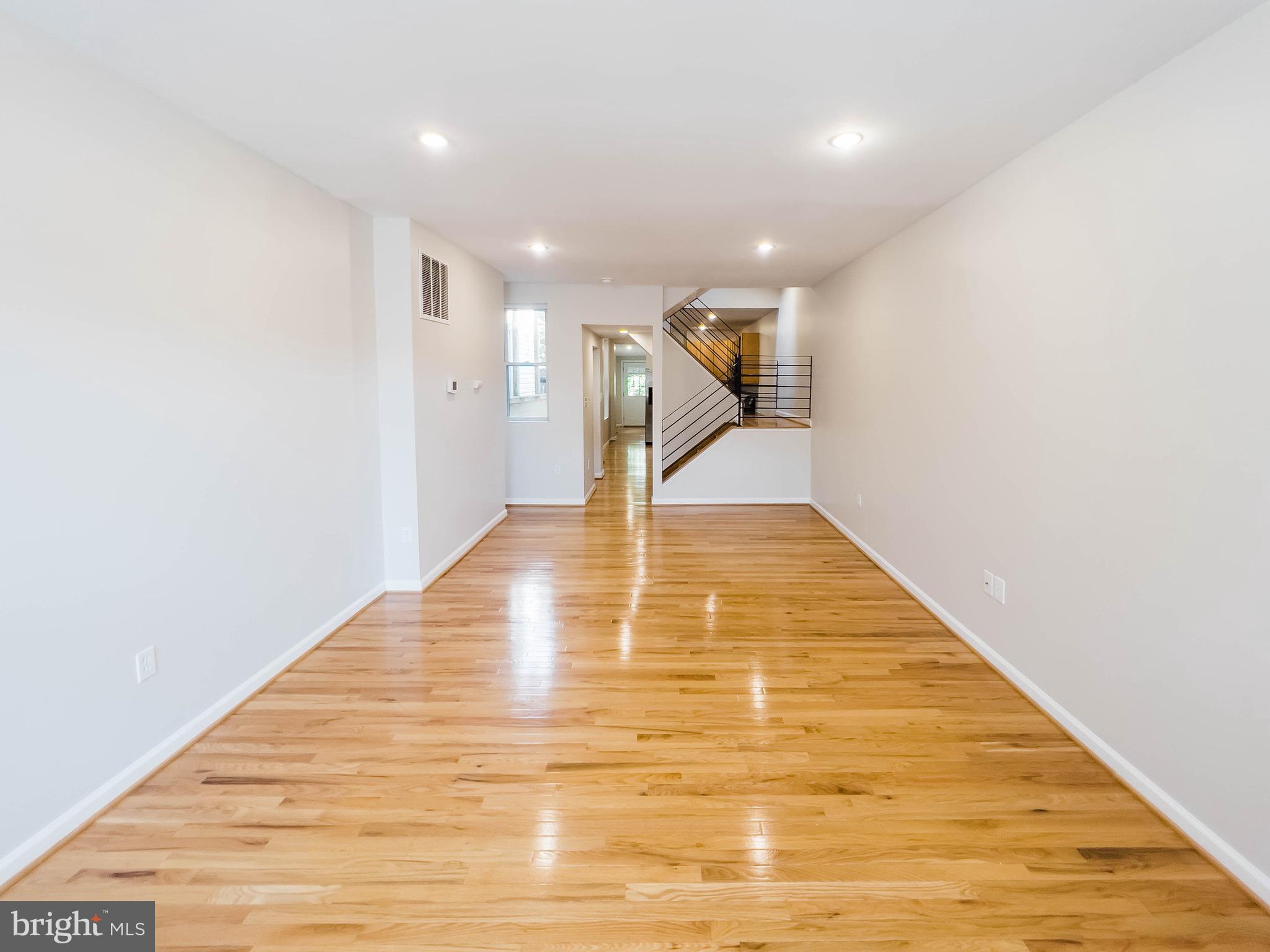 721 South Milton Avenue Baltimore, MD 21224 - Photo 4 of 23 a view of an empty room