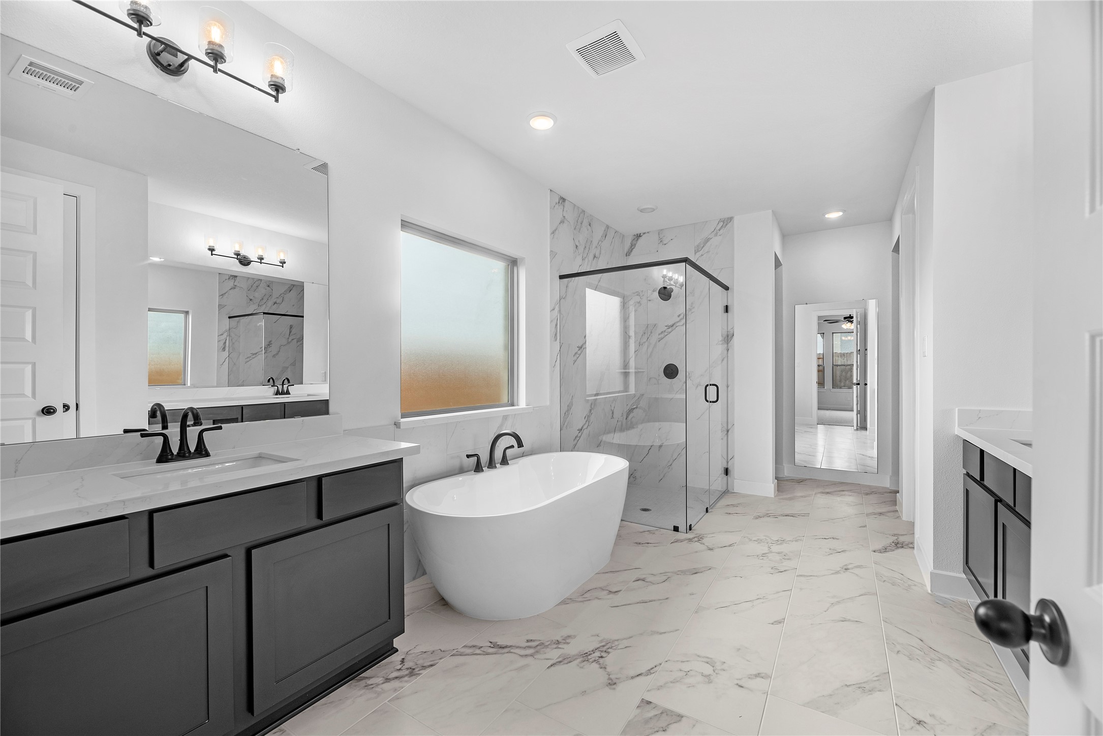 615 Roland Lane Rosenberg, TX 77471 - Photo 11 of 26 a large bathroom with a double vanity sink mirror and double