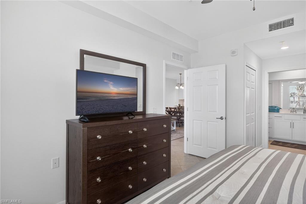 43985 Boardwalk Loop, Unit 2115 Punta Gorda, FL 33982 - Photo 13 of 28 a room with furniture and flat screen tv