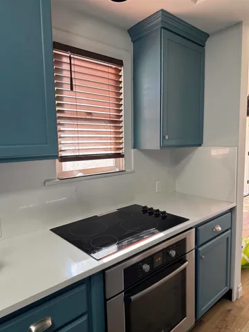 a spacious bathroom with double vanity and a large mirror