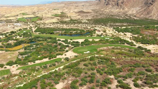 a view of mountain with an ocean