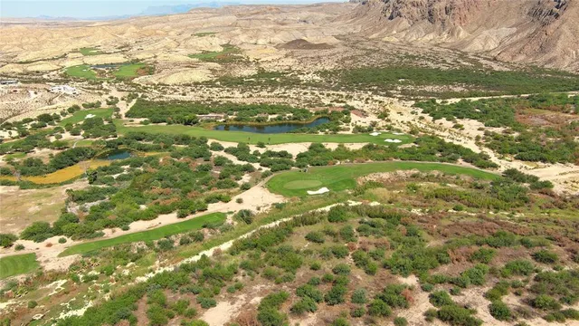 a view of mountain with an ocean