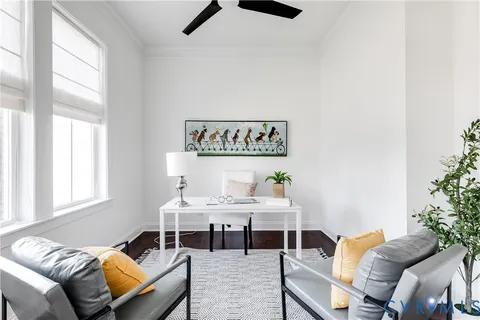 a bedroom with a bed and ceiling fan
