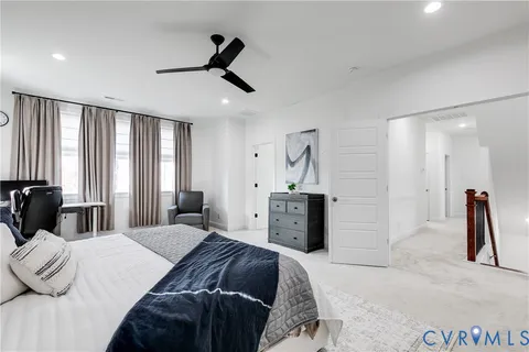 a bathroom with a double vanity sink mirror and bathtub