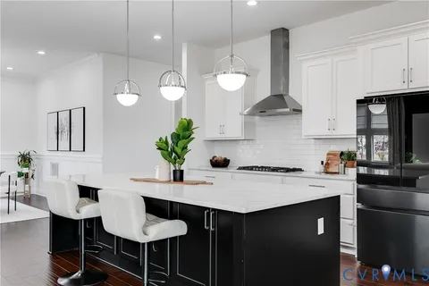 a kitchen with a table and chairs in it