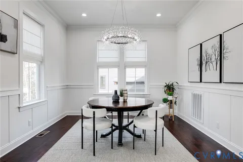 a dining room with furniture and window