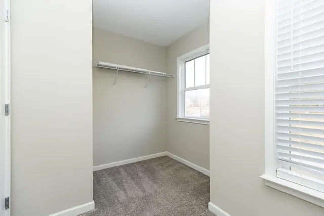 a view of a room that has a window in it