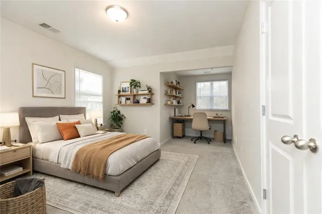 a bedroom with a bed and a couch