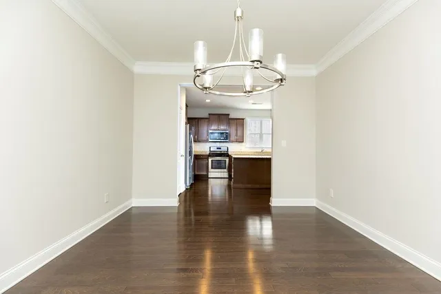 a view of a kitchen with a sink stainless steel appliances and cabinets