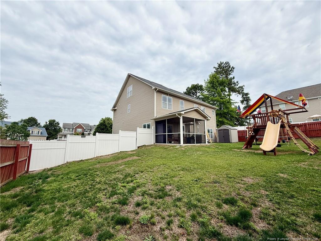 35 Ambrose Point Cameron, NC 28326 - Photo 29 of 31 a view of a house with a yard and sitting area