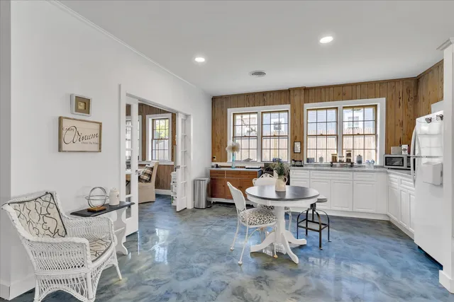 a dining room with furniture and window