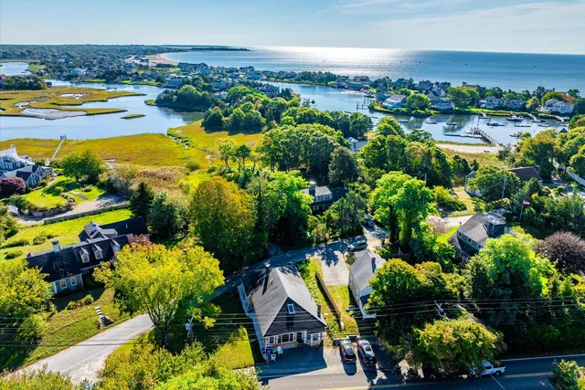 a view of a lake with lawn chairs