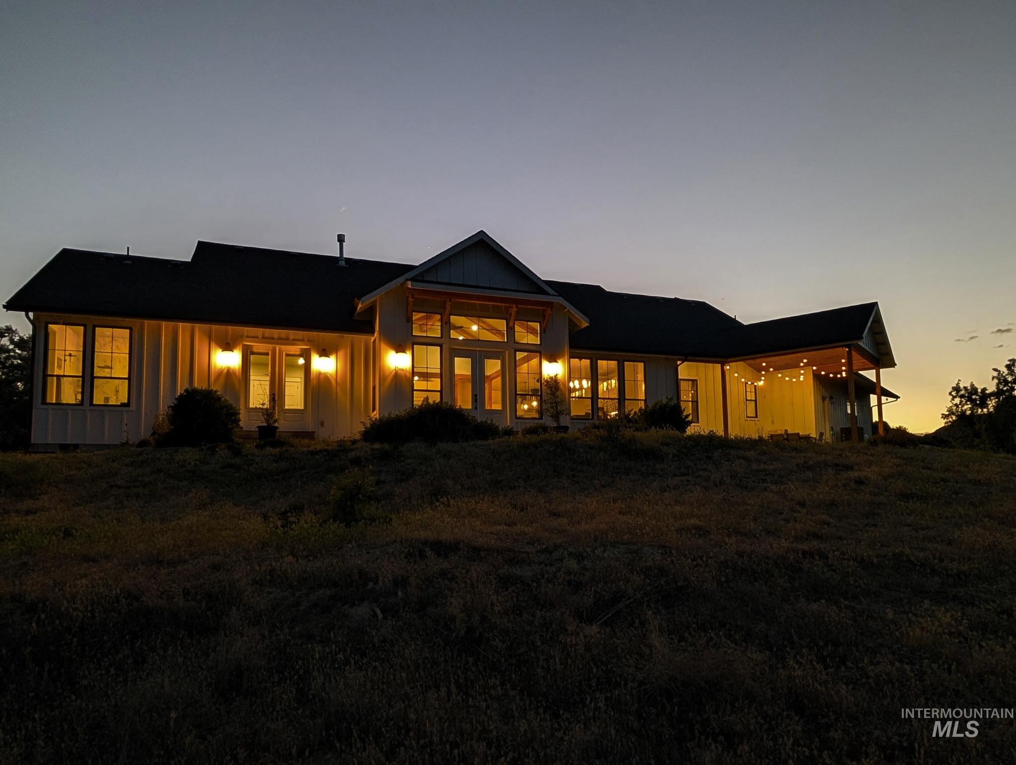 876 Coyote Gulch Road Adrian, OR 97901 - Photo 4 of 50 Modern farmhouse-style exterior featuring vertical board-and-batten siding