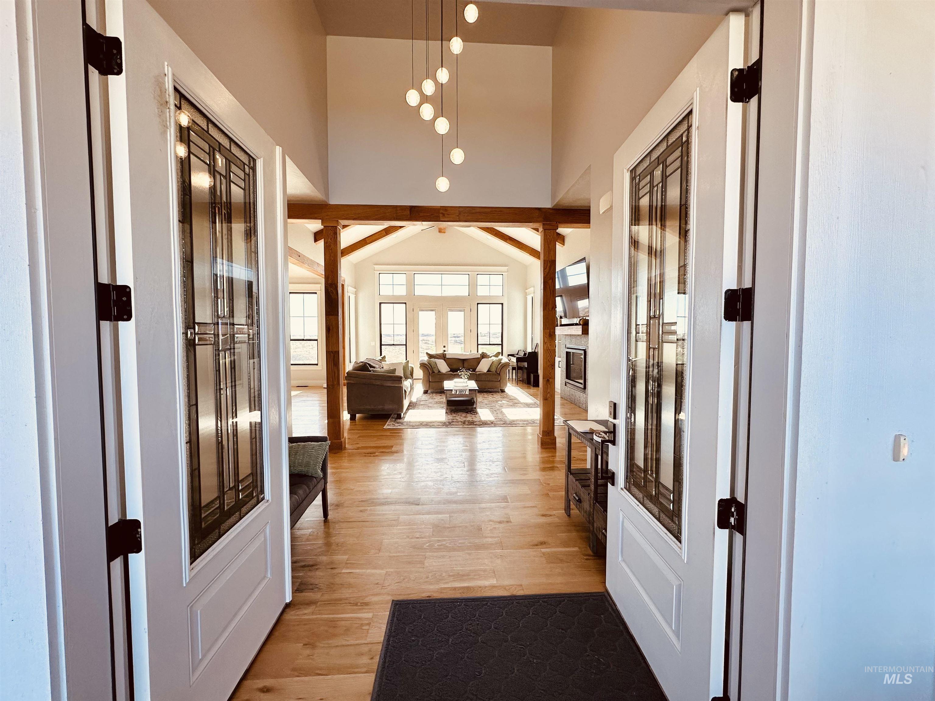 876 Coyote Gulch Road Adrian, OR 97901 - Photo 5 of 50 Spacious entry featuring double doors with decorative glass panels, leading to an expansive open-concept living area