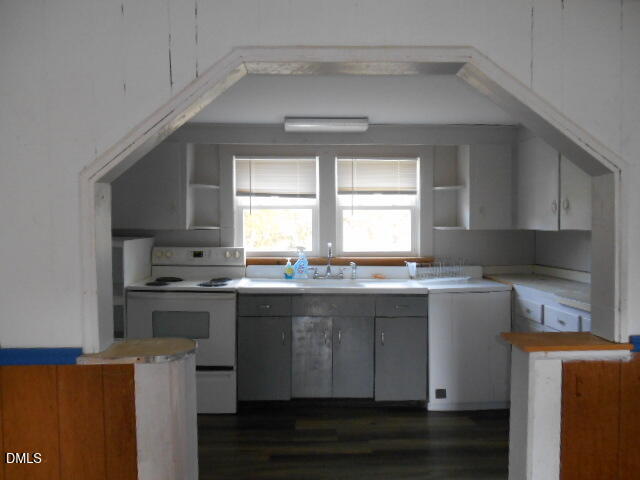 130 Holland Road Angier, NC 27501 - Photo 13 of 22 a kitchen with stainless steel appliances granite countertop a stove and a sink