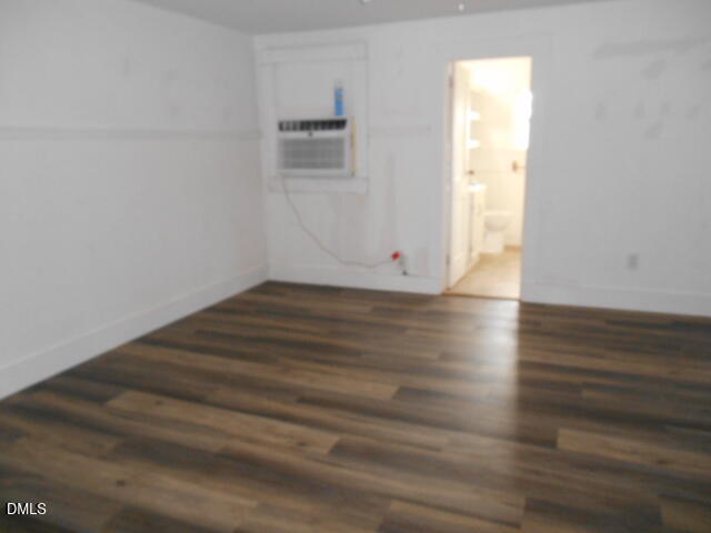 130 Holland Road Angier, NC 27501 - Photo 16 of 22 a view of an empty room with wooden floor and a window