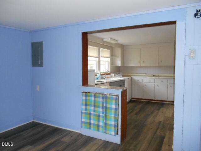 130 Holland Road Angier, NC 27501 - Photo 19 of 22 a kitchen with a wooden floor and a window