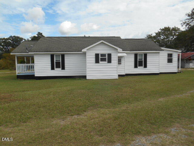 130 Holland Road Angier, NC 27501 - Photo 3 of 22 a front view of a house with yard